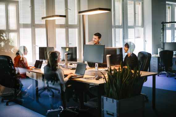 Indoor shot of young business people working in modern office space