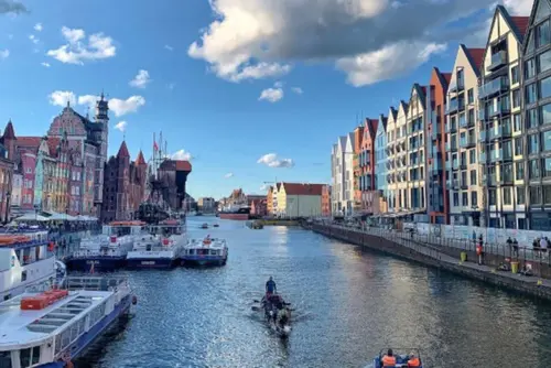 Photo shows Central Gdansk - view to old habour. Sujet from the section "Business tourism" on visitgdansk.com,  from 2024 "Visit Gdansk", the Gdansk Tourism Organization.